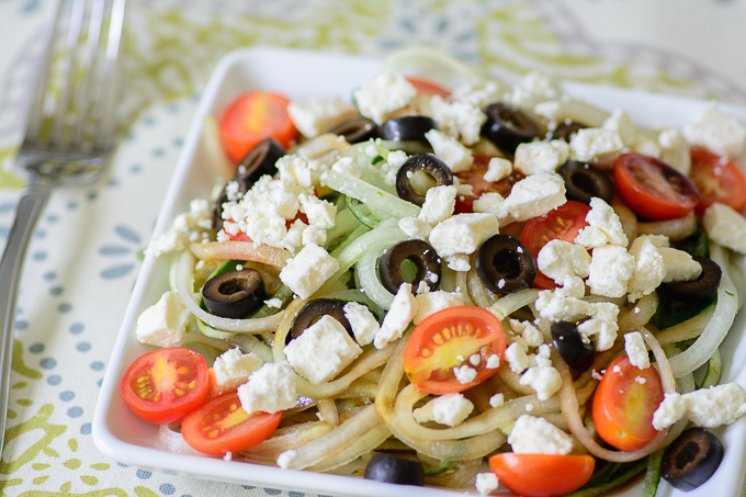Greek Cucumber "Noodle" Salad. Healthy twist on pasta salad. Great for BBQ's and parties. Perfect for those on a paleo or gluten free diet. 