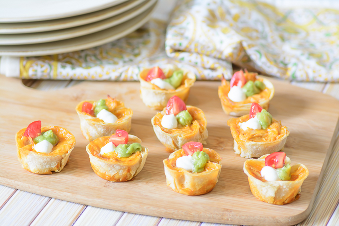 Cheesy Chicken Enchilada Bites. The melty cheesy center and zesty enchilada sauce combine to create a delectable flavor explosion. This is a must try appetizer recipe for your next party. 
