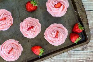 Neopalitan Cupcakes. Made with all natural ingredients and topped with a delicious real strawberry buttercream. Fun cupcake recipe!