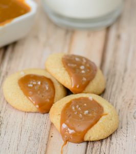 Gluten Free Caramel Thumbprint Cookies: Only 6 ingredients to these melt-in-your-mouth holiday cookies. Buttery and soft with the perfect amount of caramel. They are simply delicious!