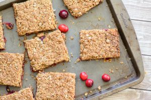 Gluten Free Cranberry Oat Bars. Yummy fall recipe made with fresh cranberries, oats and almond flour. Delicious!
