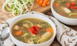 Healthy, low carb, paleo and gluten free alternative to regular chicken noodle soup. Kick it up a notch with the addition of soy sauce, ginger and a little chili pepper. Even if you don't usually like zucchini, you will LOVE this recipe!