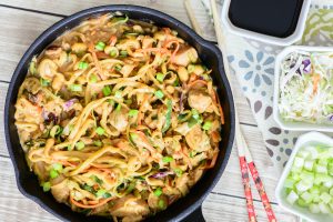 Fresh and healthy One Skillet Thai Peanut Chicken Zoodle Bowl. Made with healthy zucchini noodles, this meal will make your taste buds AND waistline happy. Win-win! You have to try this delicious zoodle recipe!