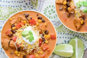 Cozy up with this tasty One Pot Baja Chicken Enchilada Soup! It's healthy, hearty, and full of robust flavor! If you only ever make one mexican soup recipe, it should be this one!