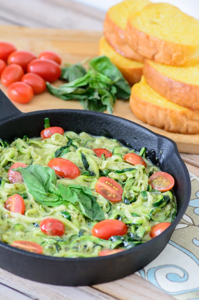 Creamy pesto with fresh zucchini noodles. These are a healthy, low carb, paleo and gluten free alternative to regular noodles. You won't even miss the pasta! Arguably the best zoodle recipe out there. 