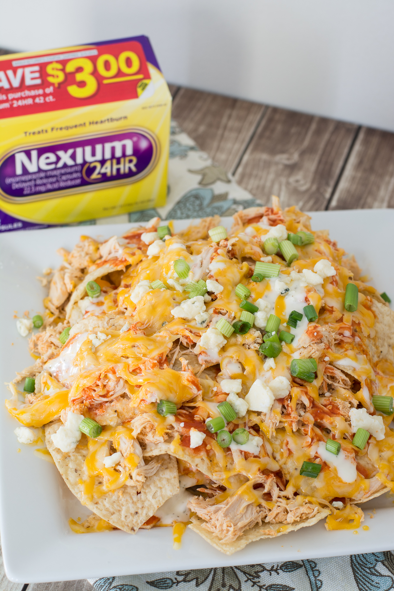 Loaded Buffalo Chicken Nachos. Shredded buffalo chicken, creamy cheese sauce, blue cheese crumbles and chopped green onions make these nachos the ultimate game day appetizer! 