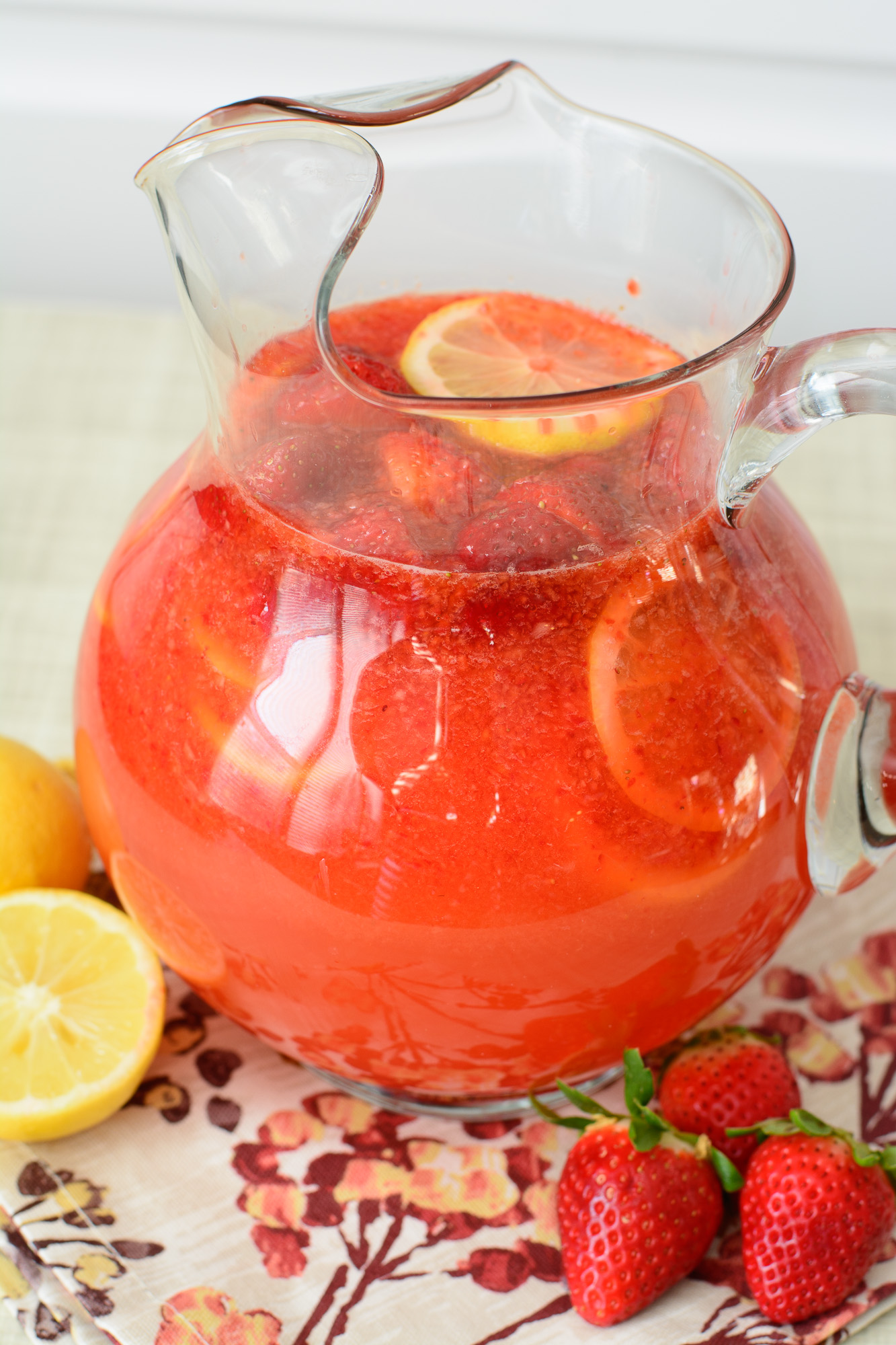 This Strawberry Lemonade recipe is wonderfully refreshing & sweet. Made from scratch with fresh lemon juice and strawberries, everyone is sure to love this recipe!